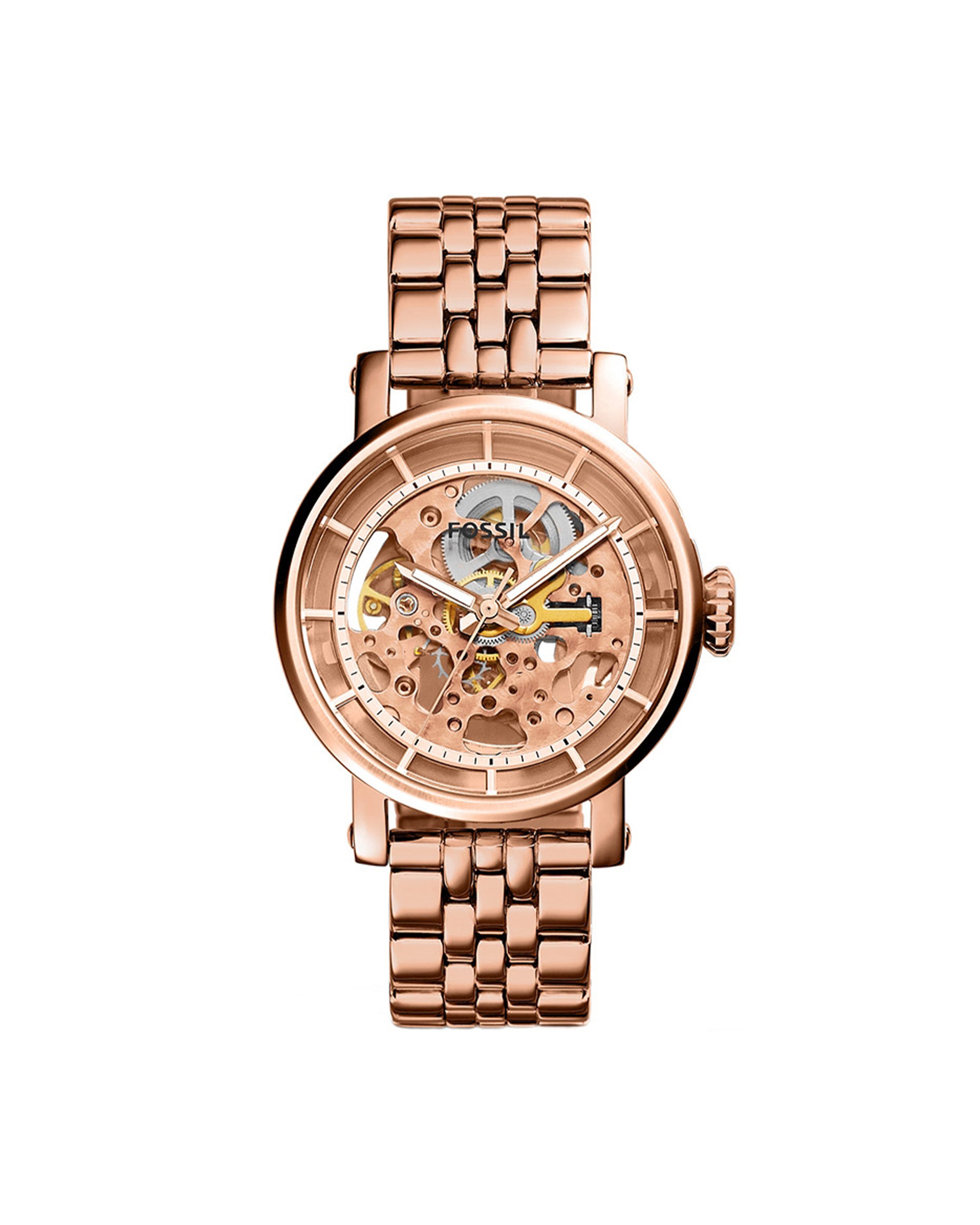 A rose gold-tone stainless steel Fossil watch with a skeleton dial, luminous hands, and a bracelet.